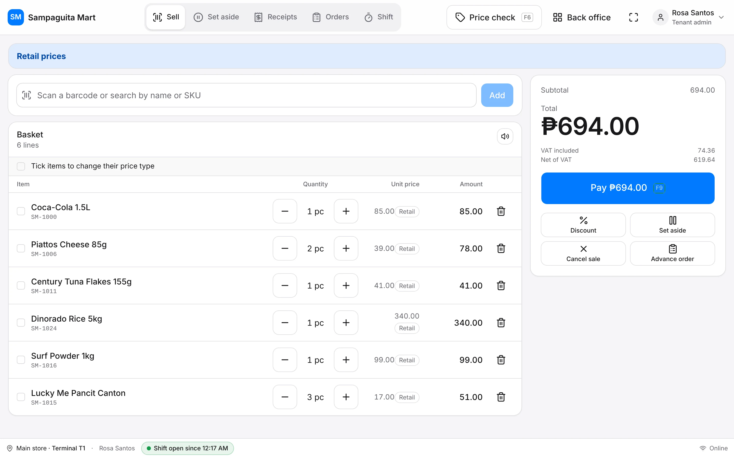 The Sell screen: a basket of scanned items, the total and a Pay button